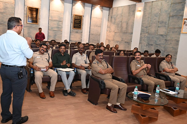 Speaker delivering a presentation to Chennai Police Commissioner & senior officials during a meeting