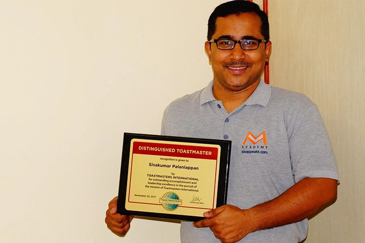 Keynote speaker receives Distinguished Toastmasters Award while inspiring leaders with growth mindset