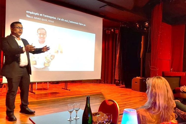 Growth coach delivers a powerful leadership keynote onstage at international conference in Paris.