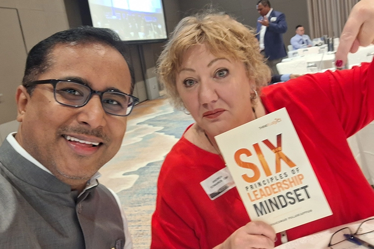 Leadership keynote speaker engages with the global authors during a book release in Singapore.