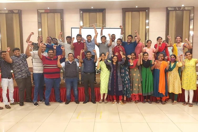 Corporate trainer guides Softsquare managers through leadership mastery session for business growth.